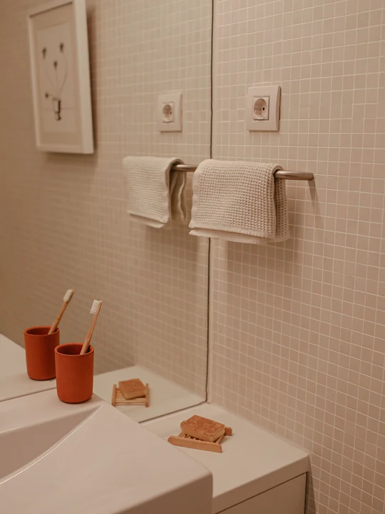 A bathroom sink and towel rail — distinctive, and lit the same way every morning: a good spot for a photo alarm.