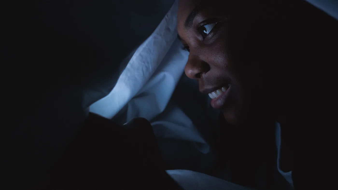 Half of adults use a screen in bed every single day. The behaviour is normal; the guilt attached to it is not proportionate.